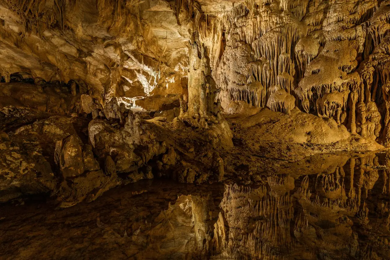 Illuminated stalactite chambers inside Prometheus Cave near Kutaisi, Georgia