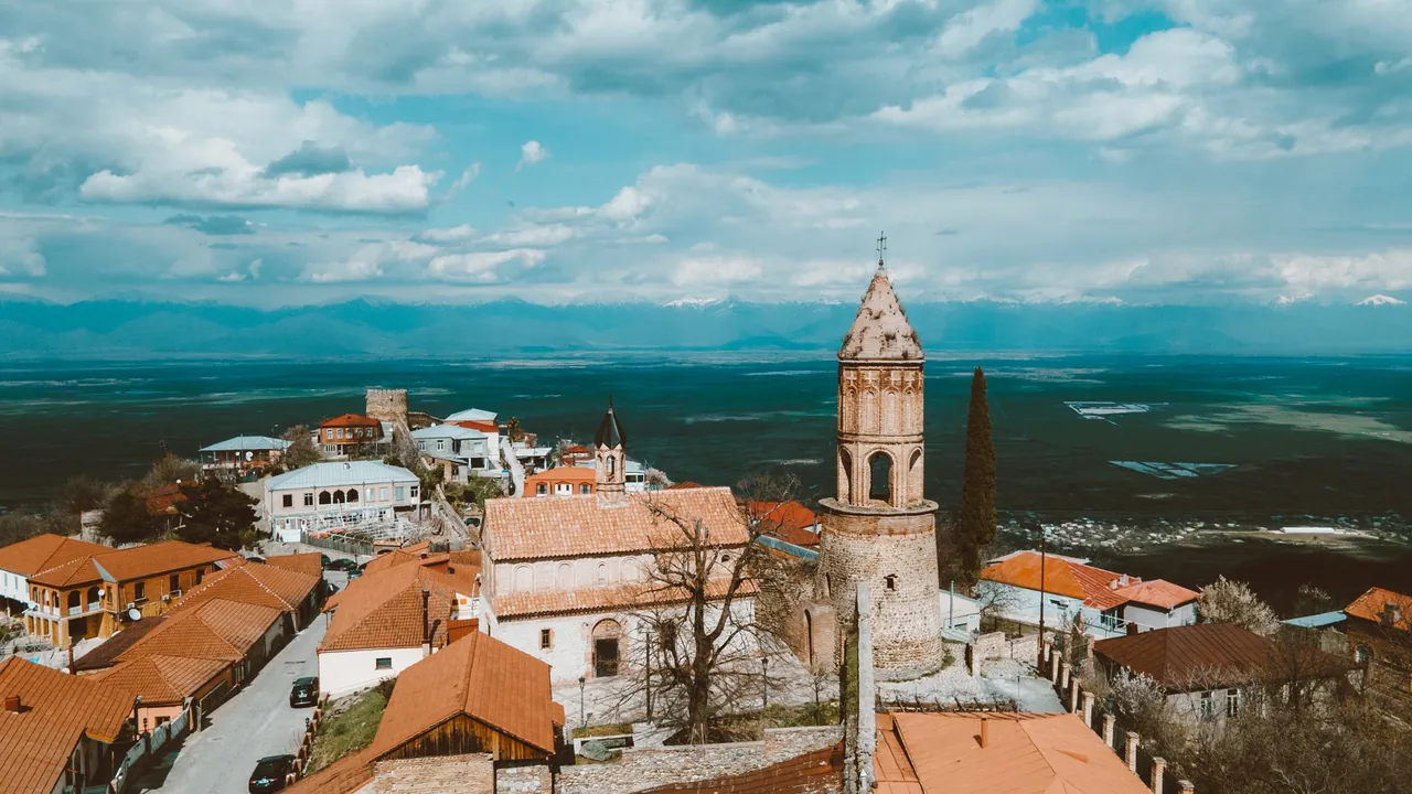 The walled hilltown of Sighnaghi overlooking the Alazani Valley vineyards in Kakheti, Georgia