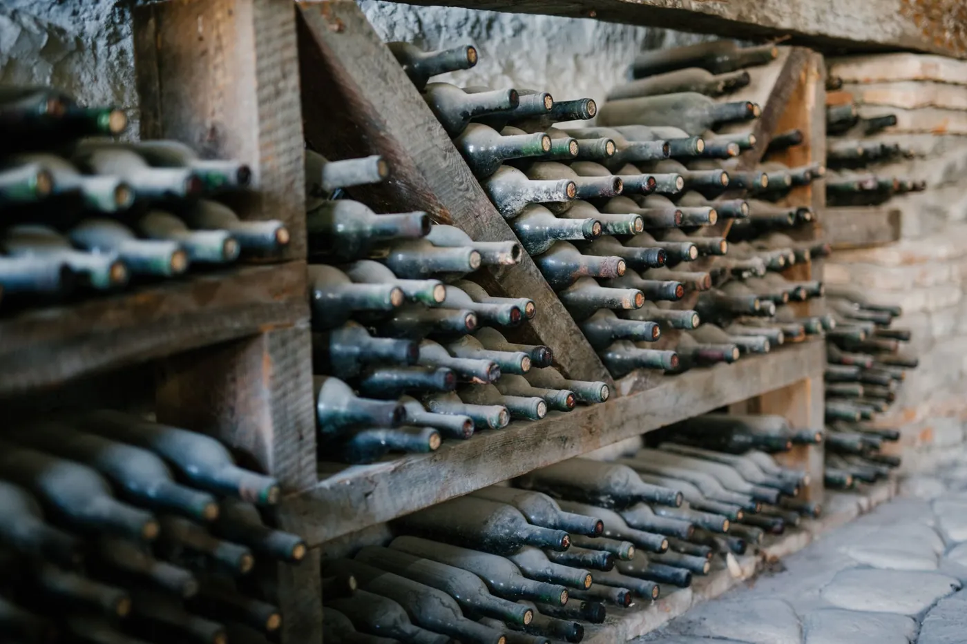 Traditional qvevri clay vessels buried in the floor of a Georgian wine cellar in Kakheti
