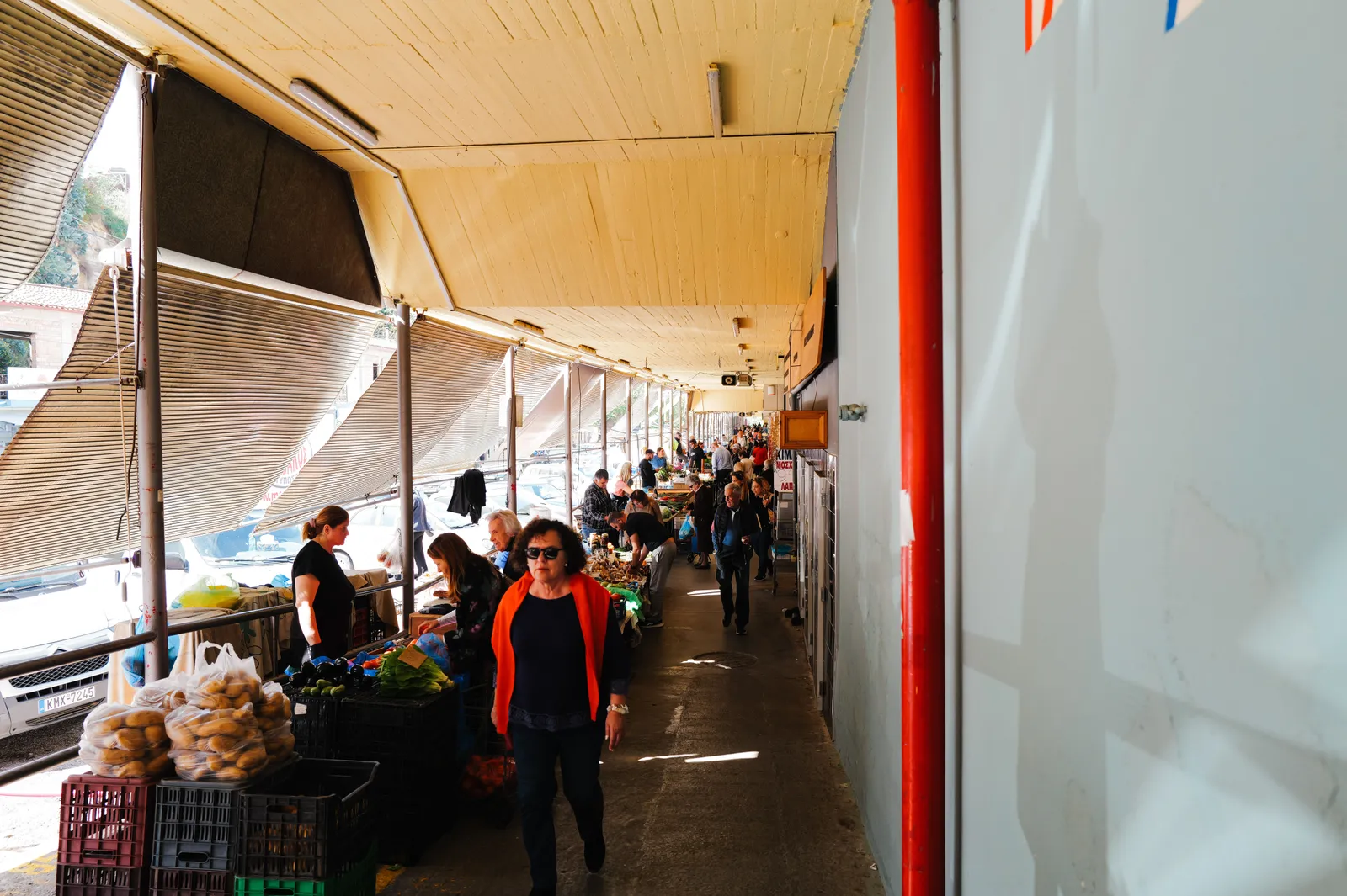 Covered market in Kutaisi with produce stalls and shoppers