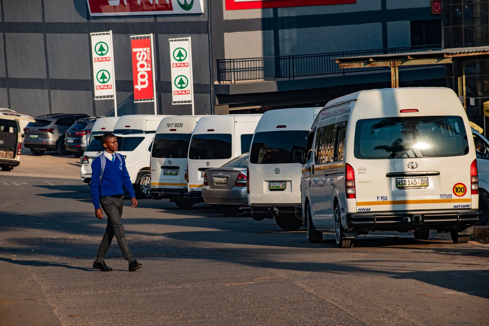 Row of minibuses with Georgian destination signs in their windscreens