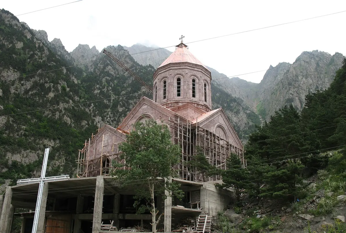 A domed church between steep slopes