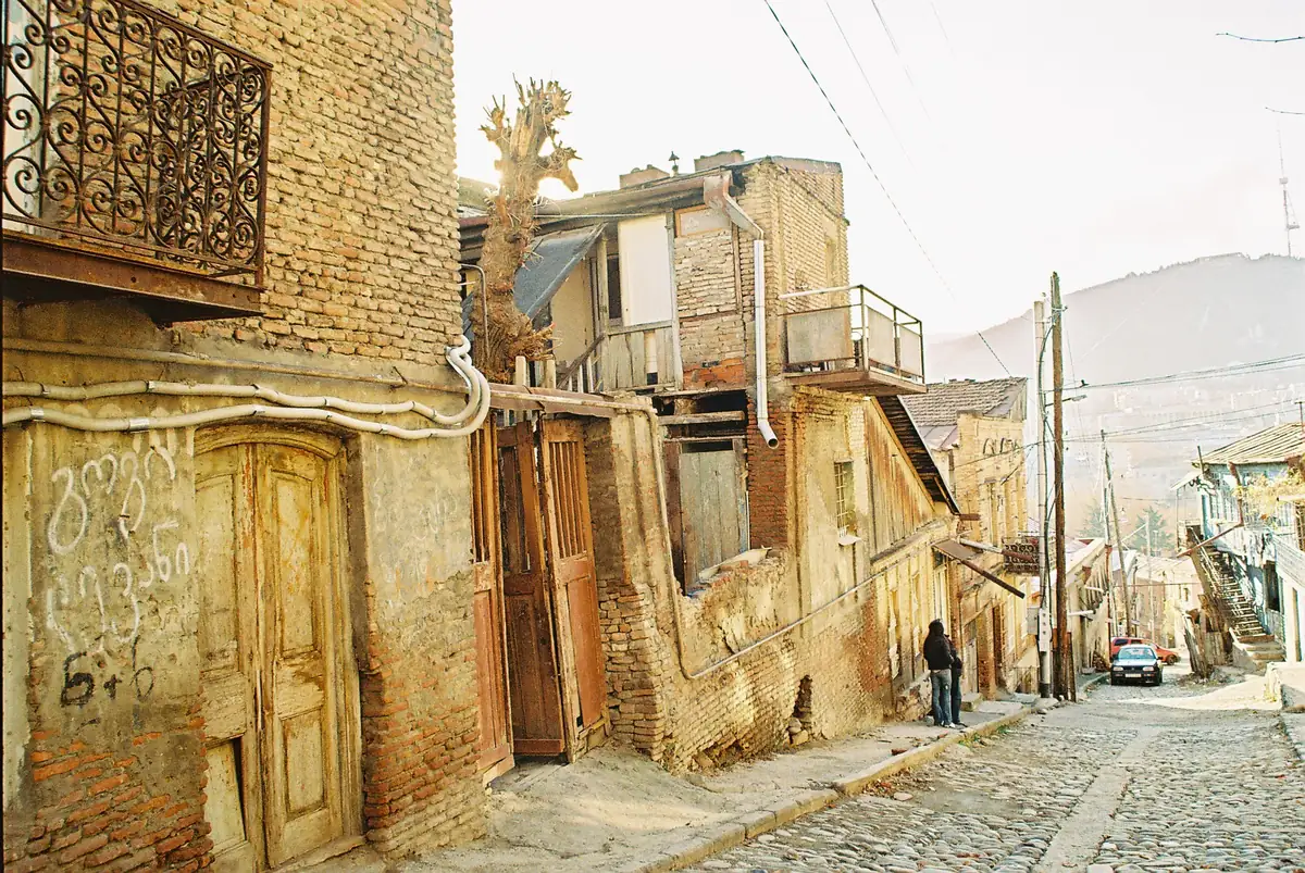 A paved lane with old houses