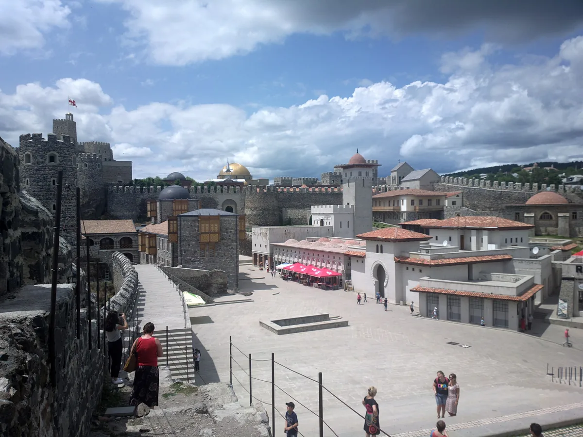 A restored fortress complex with walls and a mosque