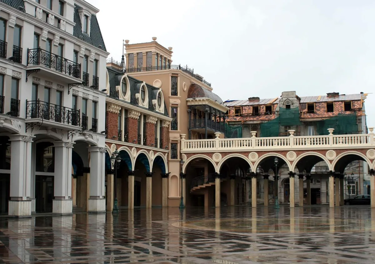 A paved square ringed by arcaded balconies
