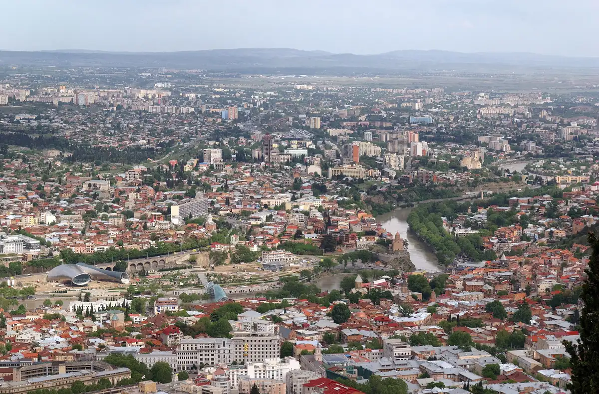 The city spread out below a hill