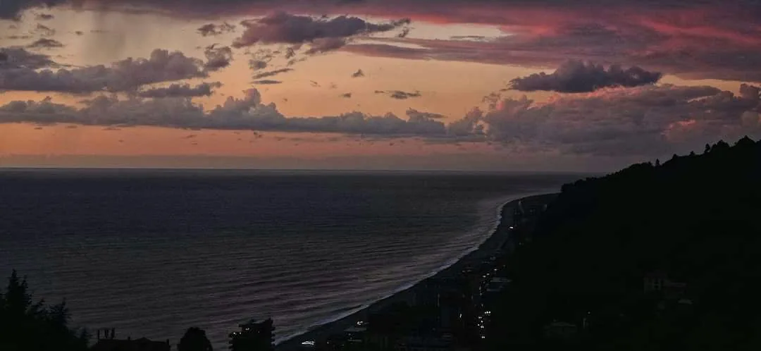 A mountainous coastline at dusk