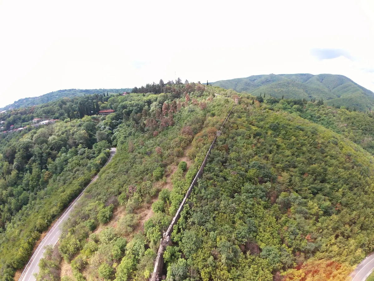 A green ridge dropping into a wide valley