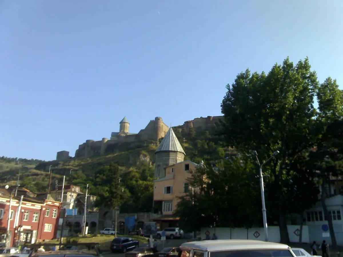 A fortress on a ridge above the city