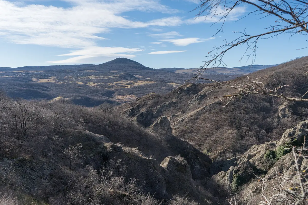 Rock outcrops and hills along a walking trail