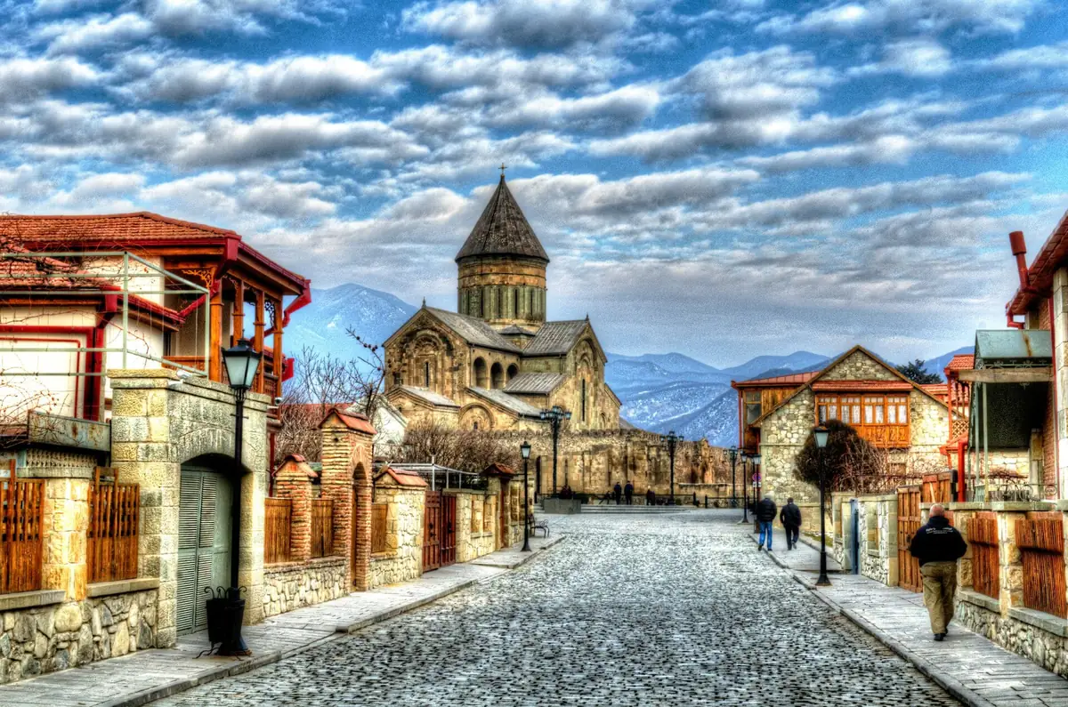 An old town in winter with a church behind