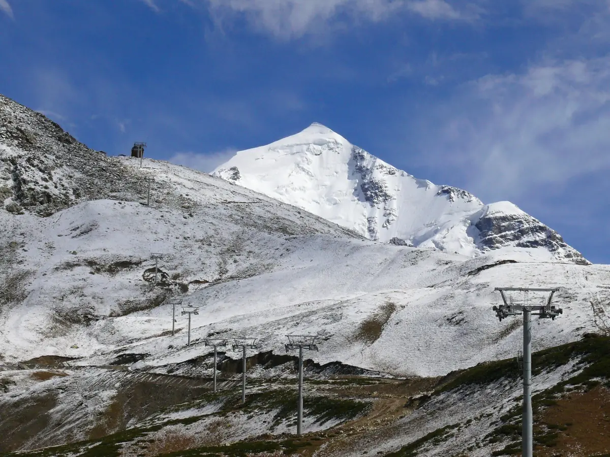 A chairlift on a snow covered slope