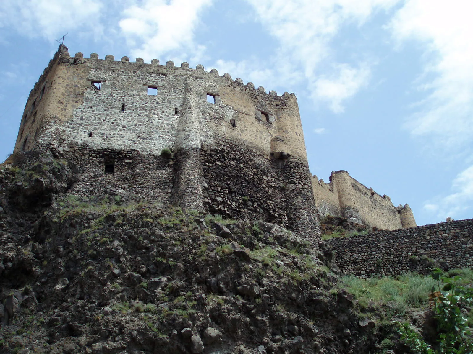 The walls and keep of Khertvisi fortress rising above the slope in southern Georgia
