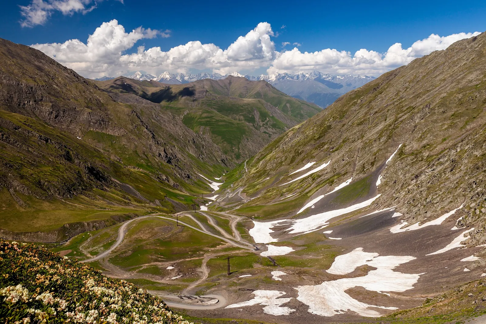 The view from the Abano pass in Tusheti, with the unpaved road winding down through the valley below